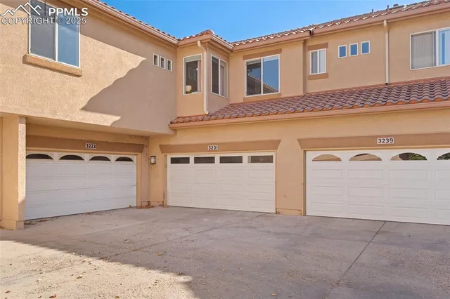 a front view of a house with parking garage