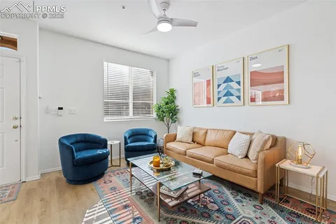 a living room with furniture rug and window