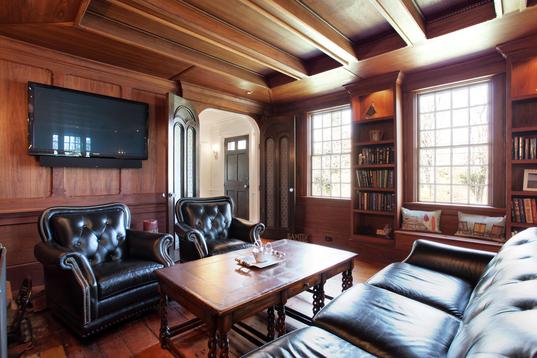 9 East Bay Road Osterville, MA 02655 - Photo 13 of 30 a living room with furniture a flat screen tv and a fireplace