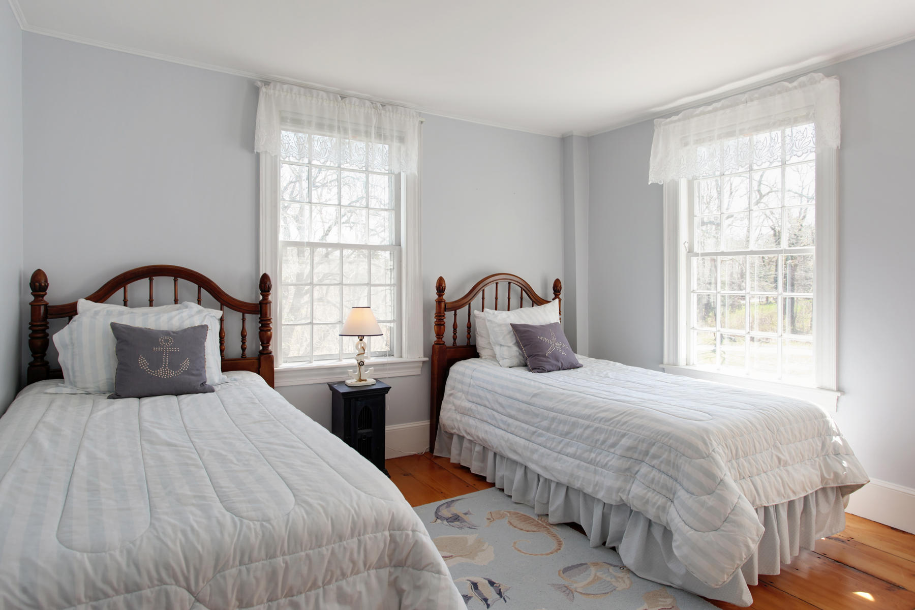 9 East Bay Road Osterville, MA 02655 - Photo 19 of 30 a bedroom with two beds and a window