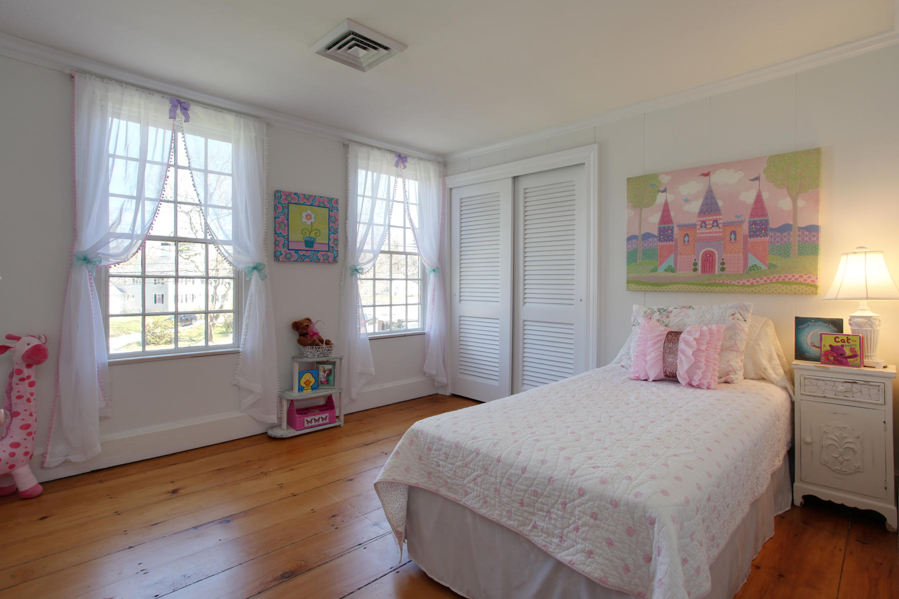 9 East Bay Road Osterville, MA 02655 - Photo 20 of 30 a bedroom with a bed and wooden floor