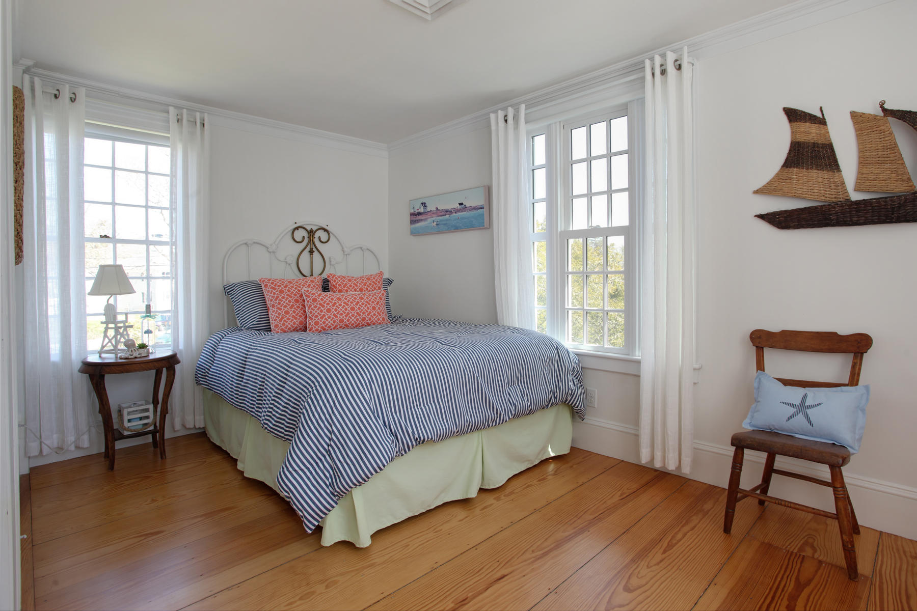 9 East Bay Road Osterville, MA 02655 - Photo 21 of 30 a bedroom with a bed and wooden floor
