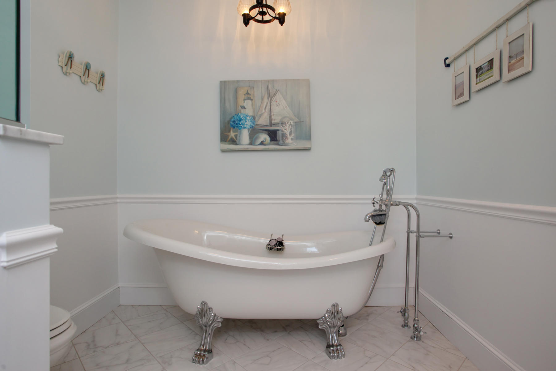 9 East Bay Road Osterville, MA 02655 - Photo 22 of 30 a view of a bathtub in a bathroom