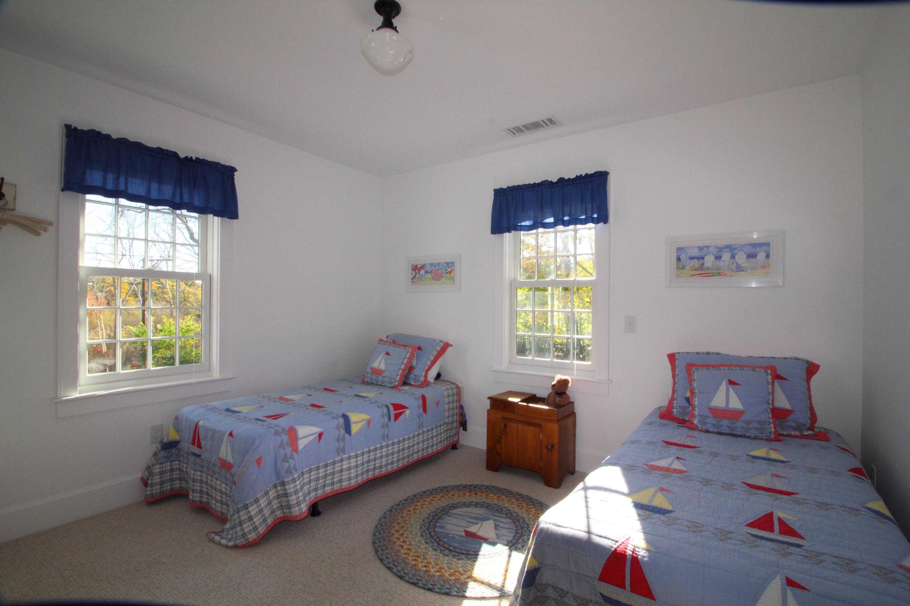9 East Bay Road Osterville, MA 02655 - Photo 24 of 30 a bedroom with a bed and window