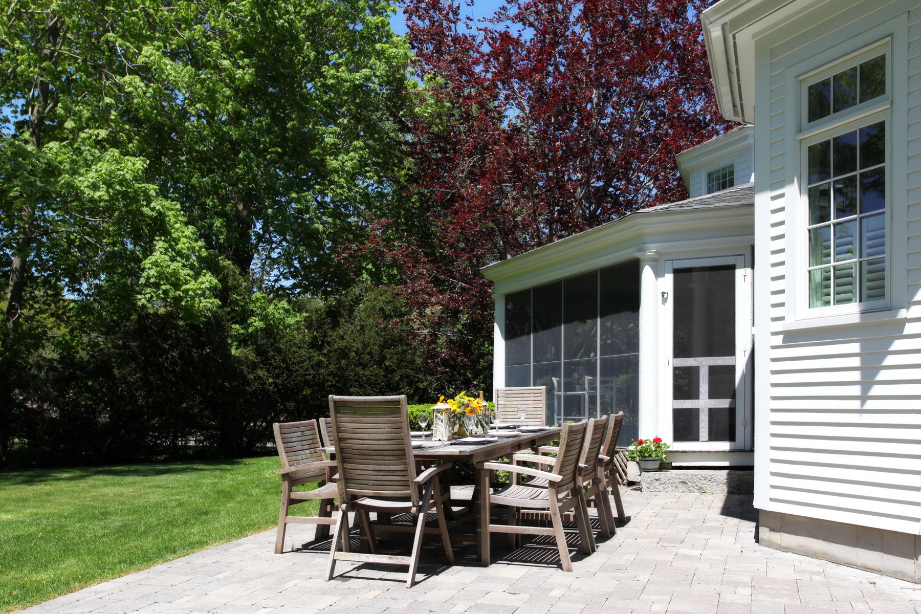 9 East Bay Road Osterville, MA 02655 - Photo 28 of 30 a view of a outdoor space with a table and chairs