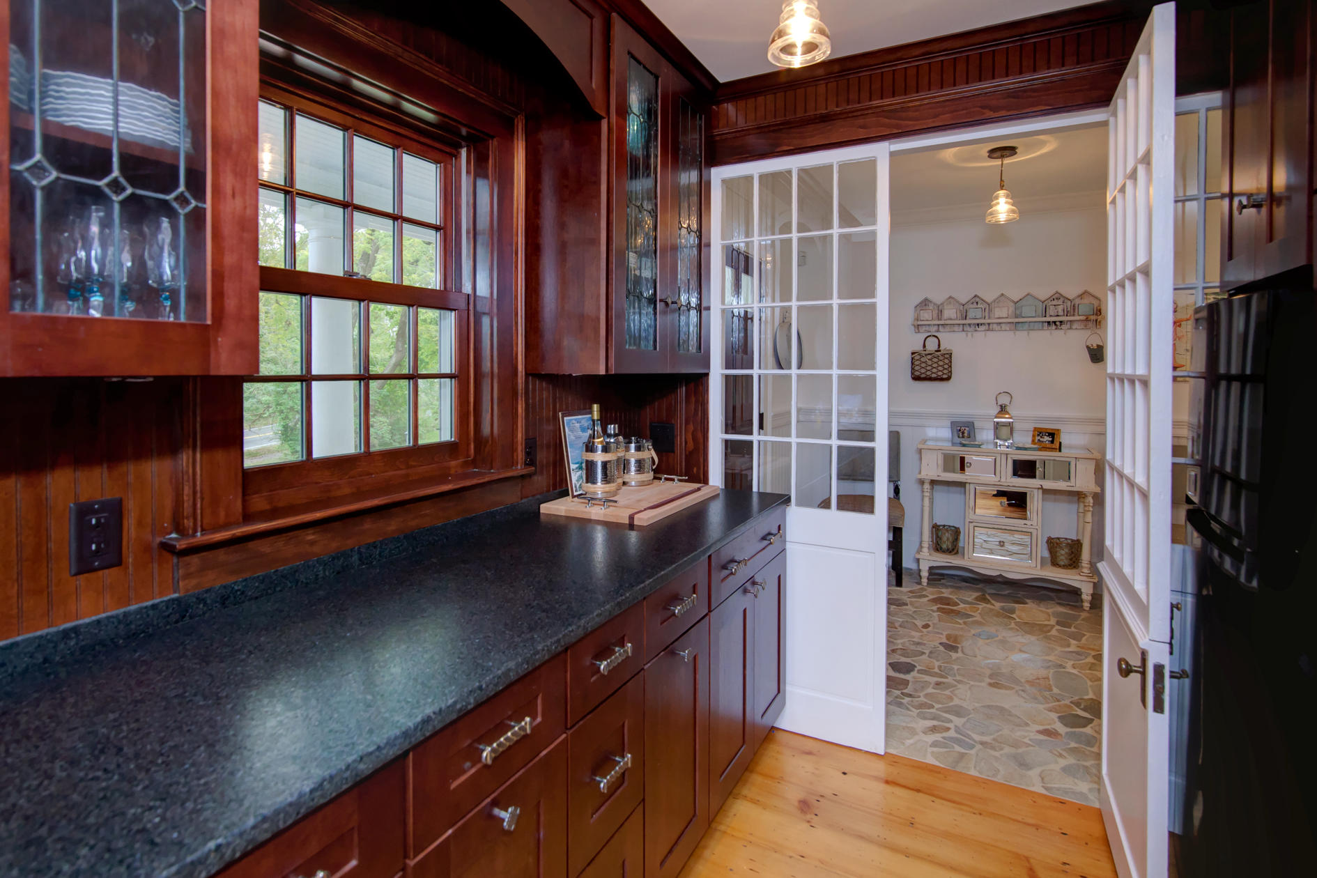 9 East Bay Road Osterville, MA 02655 - Photo 8 of 30 a kitchen with a refrigerator and a sink