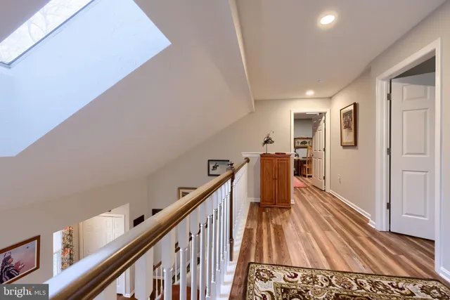 a bedroom with a bed and a night stand