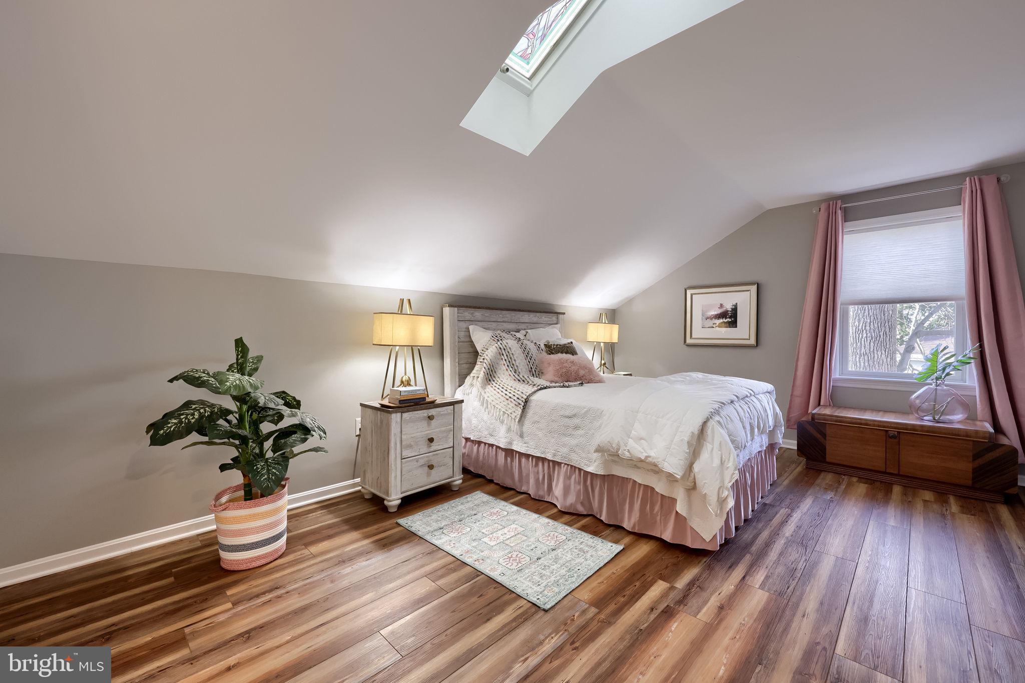 58 Timber Villa Elizabethtown, PA 17022 - Photo 15 of 60 a bedroom with a bed and wooden floor