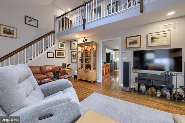 a kitchen with stainless steel appliances granite countertop a stove a refrigerator and a microwave