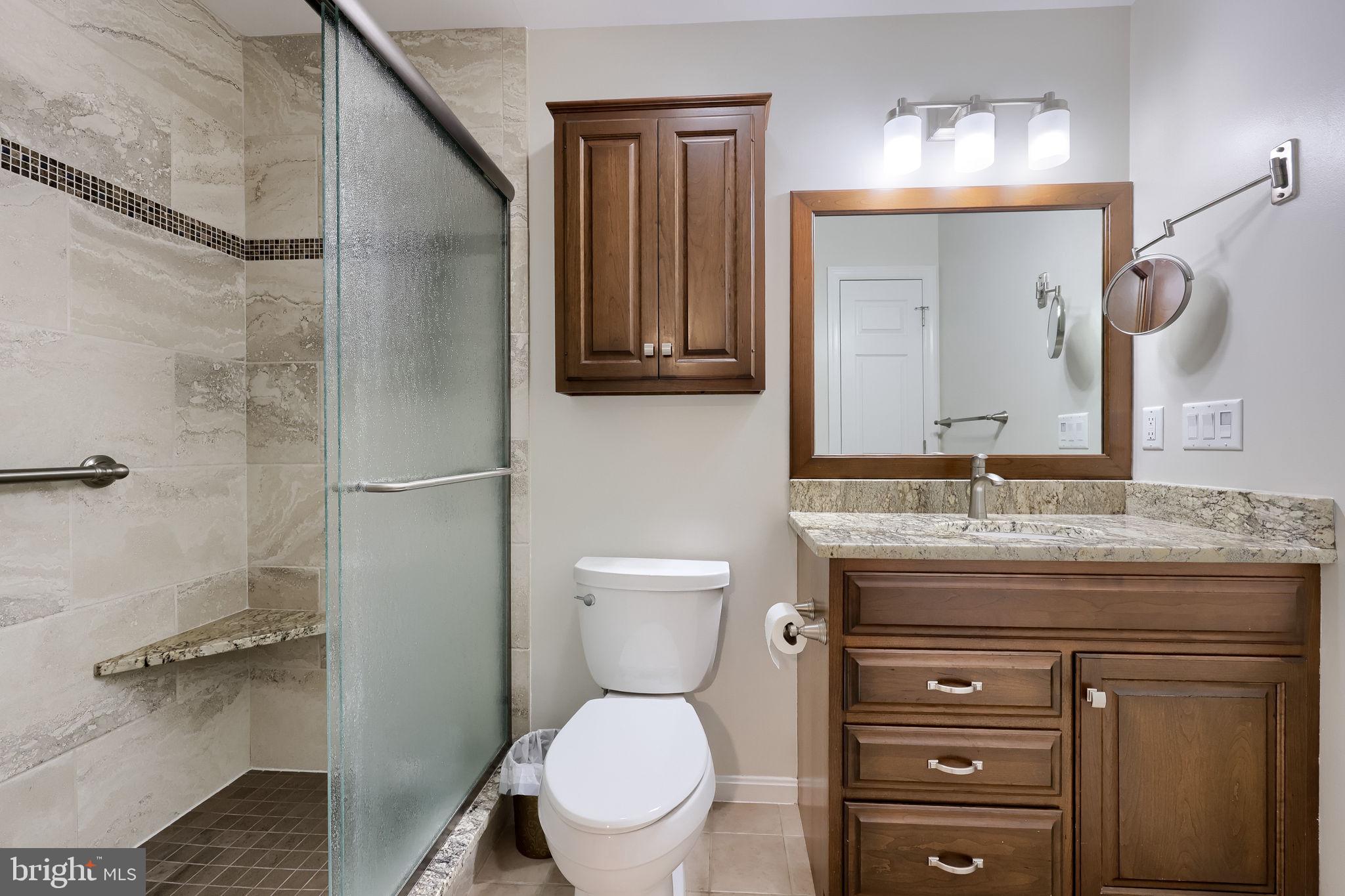 58 Timber Villa Elizabethtown, PA 17022 - Photo 34 of 60 a bathroom with a granite countertop toilet sink and a mirror