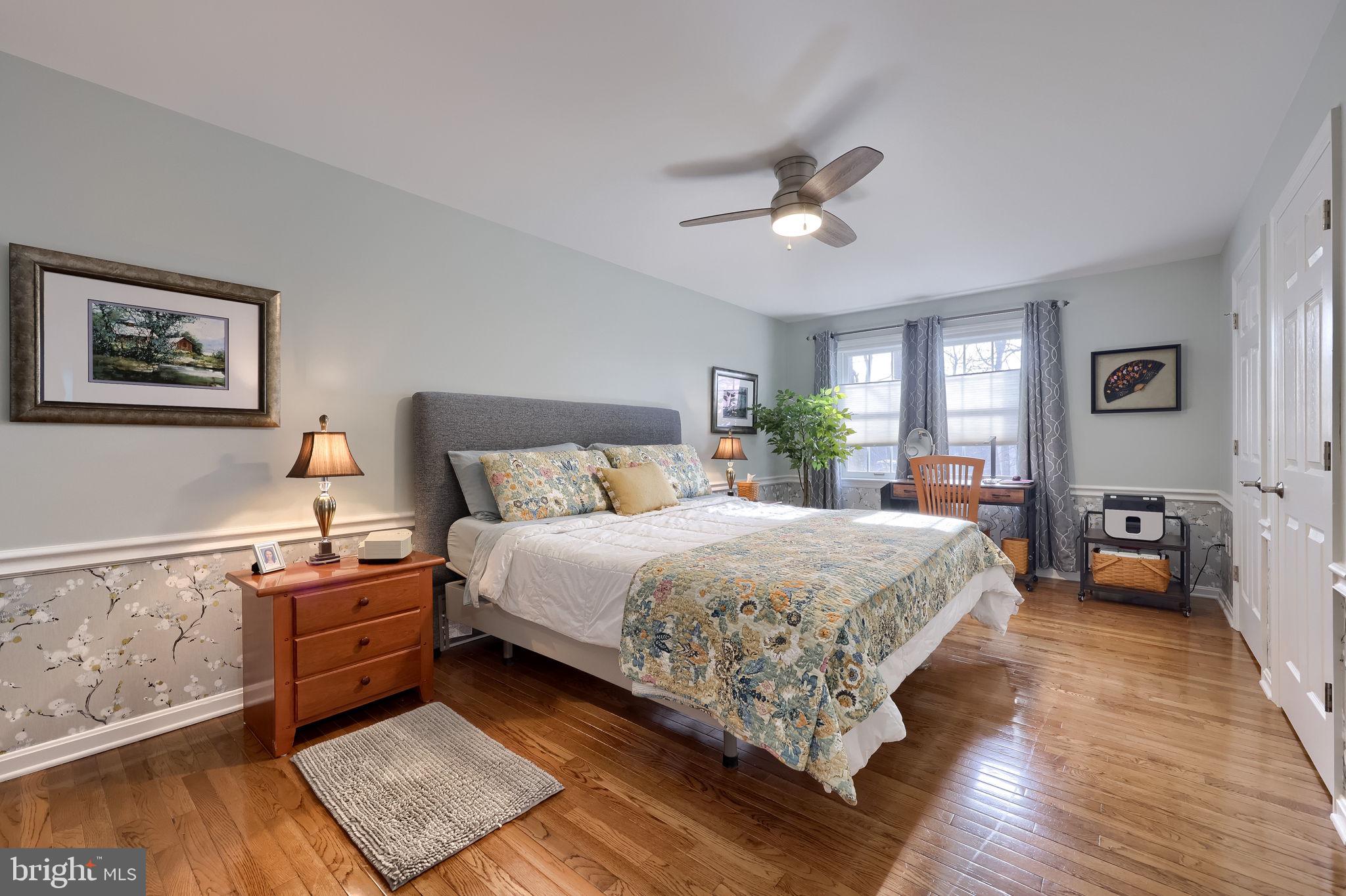 58 Timber Villa Elizabethtown, PA 17022 - Photo 37 of 60 a bedroom with a bed and wooden floor