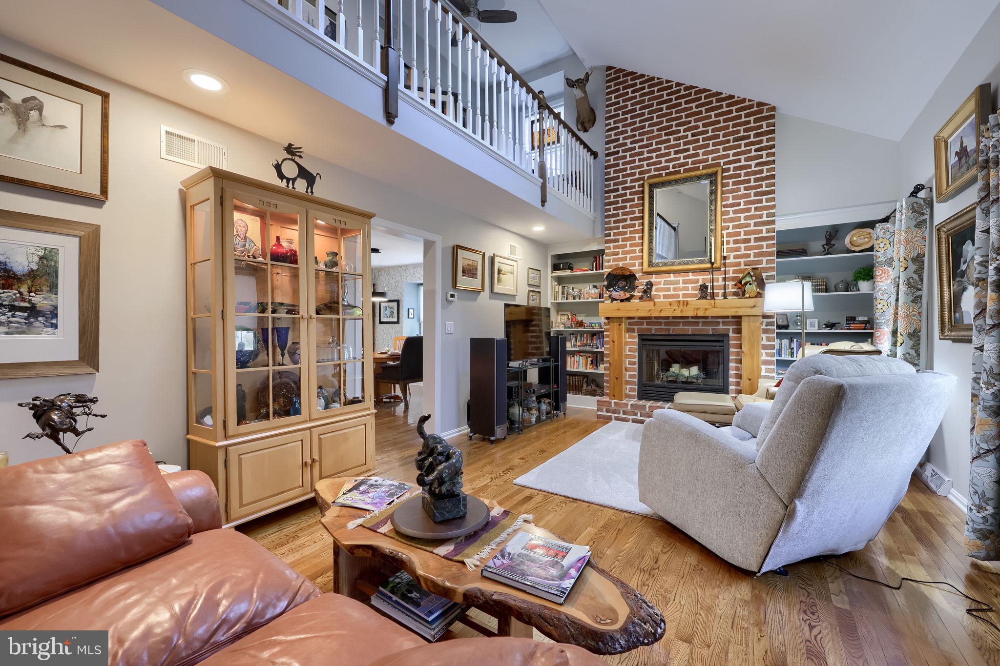 58 Timber Villa Elizabethtown, PA 17022 - Photo 7 of 60 a living room with furniture a fireplace and a large window