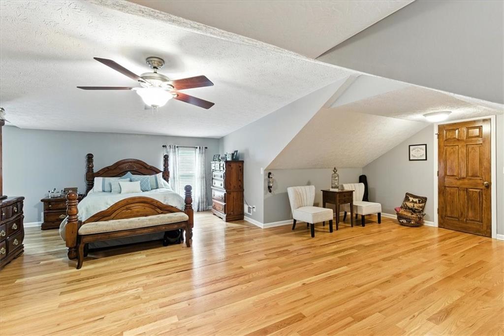 4970 Nebo Road Hiram, GA 30141 - Photo 16 of 61 a living room with furniture and a ceiling fan