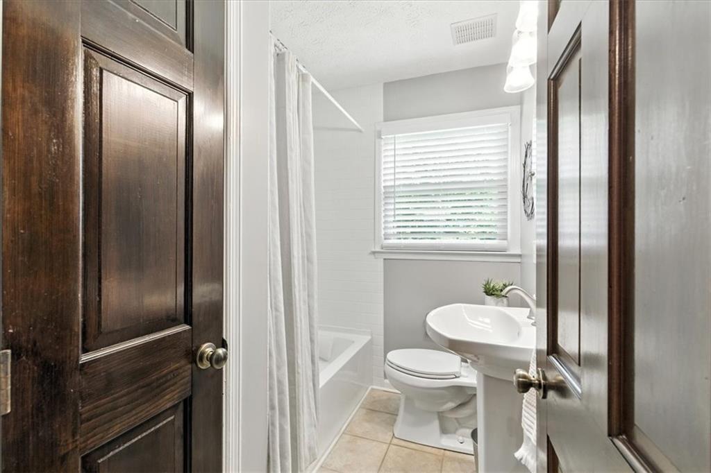 4970 Nebo Road Hiram, GA 30141 - Photo 26 of 61 a bathroom with a sink a toilet and shower