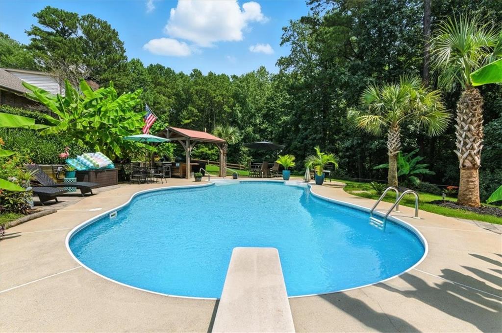 4970 Nebo Road Hiram, GA 30141 - Photo 35 of 61 a view of a swimming pool with a yard