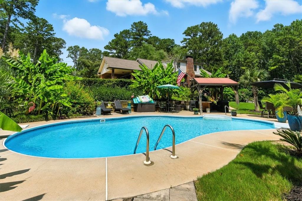 4970 Nebo Road Hiram, GA 30141 - Photo 37 of 61 a view of a swimming pool with a patio