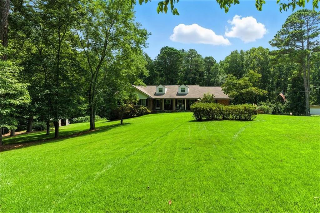 4970 Nebo Road Hiram, GA 30141 - Photo 4 of 61 a house view with a sitting space and garden