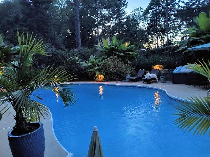 4970 Nebo Road Hiram, GA 30141 - Photo 56 of 61 a backyard of a house with barbeque oven table and chairs