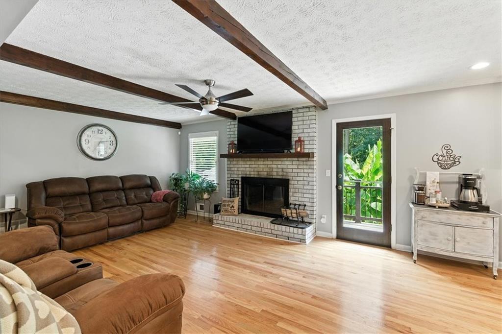 4970 Nebo Road Hiram, GA 30141 - Photo 6 of 61 a living room with furniture and a fireplace