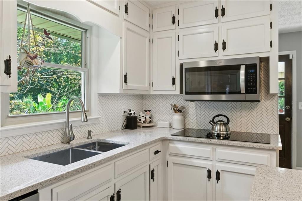 4970 Nebo Road Hiram, GA 30141 - Photo 10 of 61 a kitchen with stainless steel appliances granite countertop a sink a microwave and cabinets