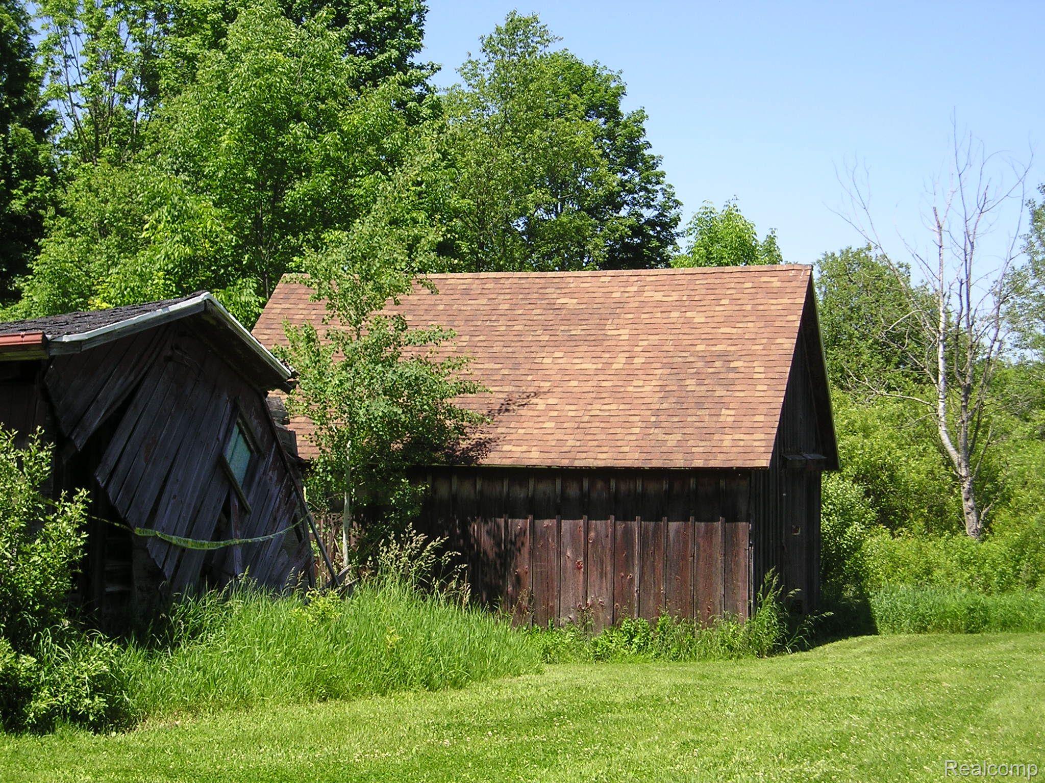 4249 East Hunters Creek Road Metamora, MI 48455 - Photo 5 of 19 One shed in fair shed, other is tear down