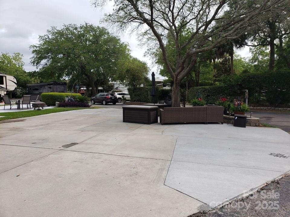 43B Jenkins Island Road, Unit 177 Hilton Head Island, SC 29926 - Photo 12 of 17 a view of backyard with outdoor seating and trees