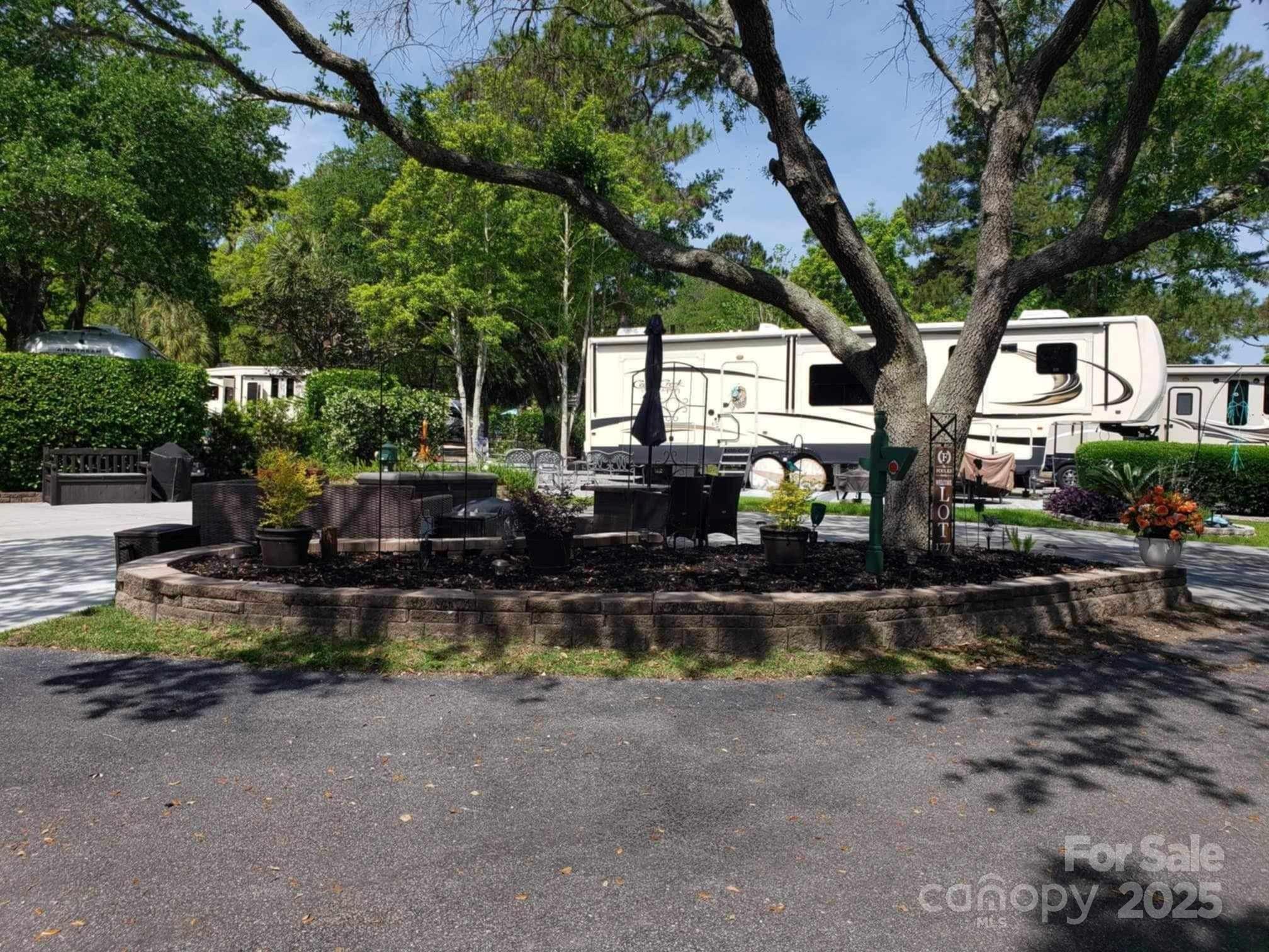 43B Jenkins Island Road, Unit 177 Hilton Head Island, SC 29926 - Photo 5 of 17 a view of backyard with outdoor seating and plants