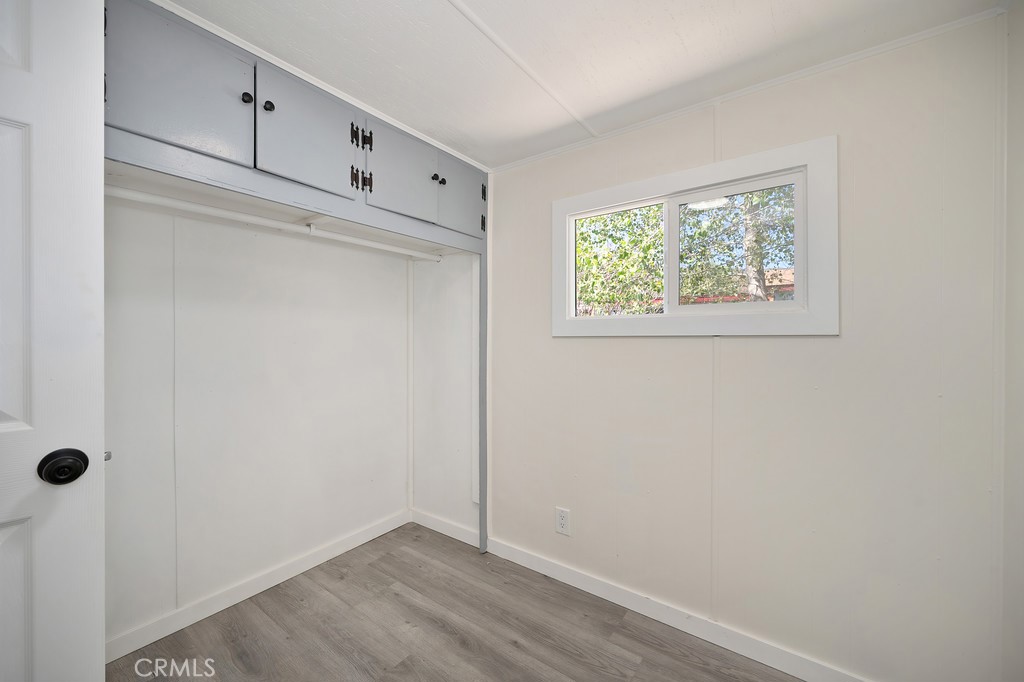 26455 Paradise Valley Road, Unit 86 Warner Springs, CA 92086 - Photo 22 of 34 a view of an empty room with wooden floor and closet