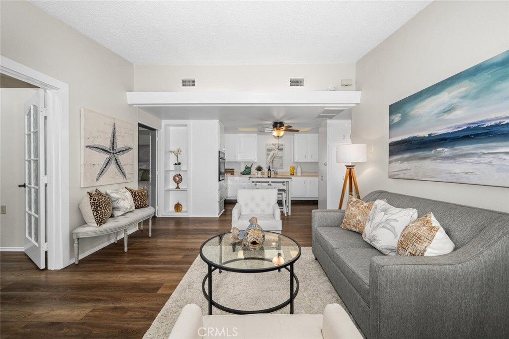 1621 Interlachen Road, Unit 265B Seal Beach, CA 90740 - Photo 13 of 36 a living room with furniture and a flat screen tv