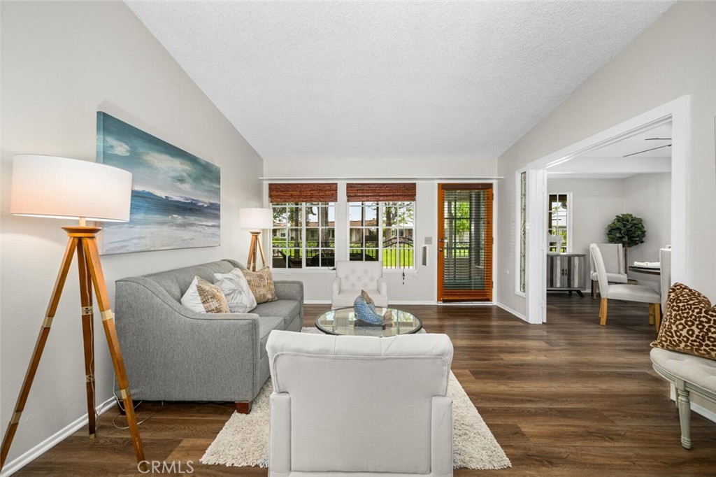 1621 Interlachen Road, Unit 265B Seal Beach, CA 90740 - Photo 15 of 36 a living room with furniture and a large window