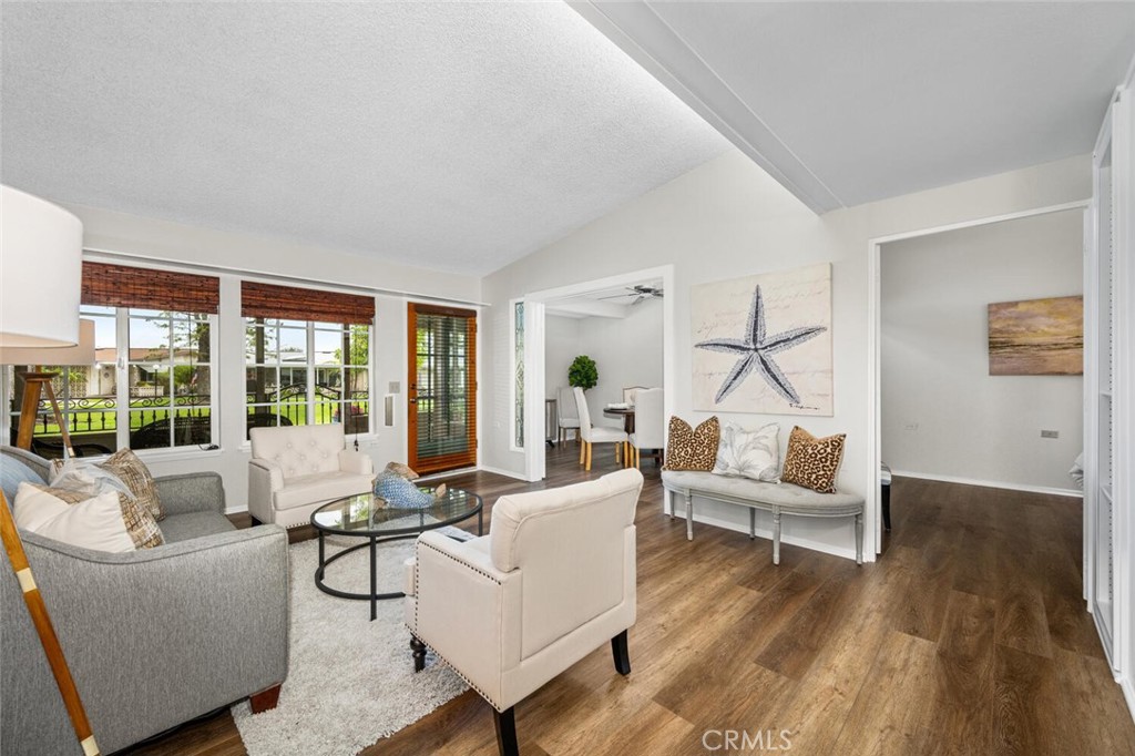 1621 Interlachen Road, Unit 265B Seal Beach, CA 90740 - Photo 16 of 36 a living room with furniture and a large window