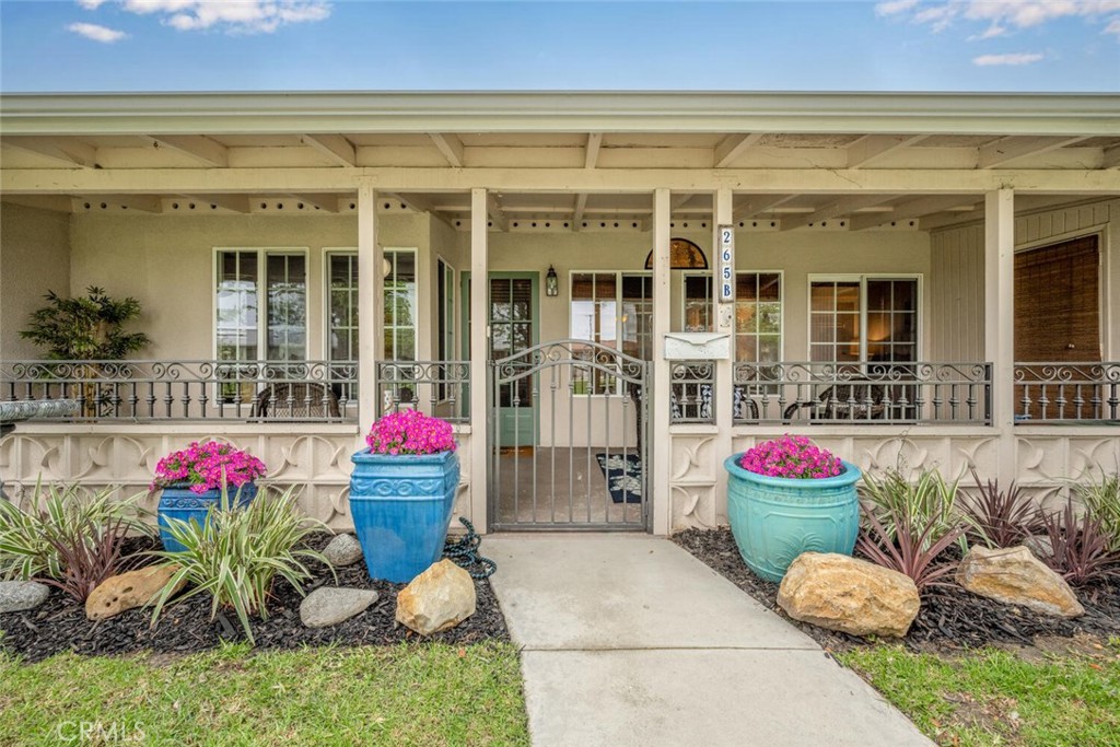 1621 Interlachen Road, Unit 265B Seal Beach, CA 90740 - Photo 2 of 36 a potted plant sitting in front of a house