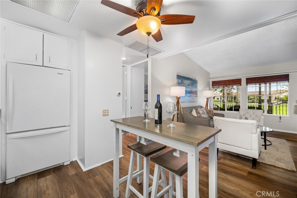 1621 Interlachen Road, Unit 265B Seal Beach, CA 90740 - Photo 25 of 36 a view of a dining room with furniture window and wooden floor
