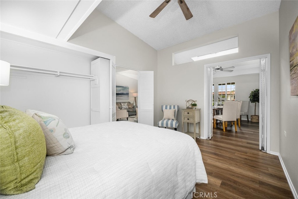 1621 Interlachen Road, Unit 265B Seal Beach, CA 90740 - Photo 29 of 36 a bed room with a bed and a chair