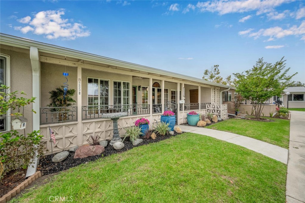 1621 Interlachen Road, Unit 265B Seal Beach, CA 90740 - Photo 3 of 36 front view of a house with a yard
