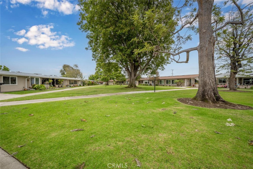 1621 Interlachen Road, Unit 265B Seal Beach, CA 90740 - Photo 5 of 36 a view of a house with a big yard