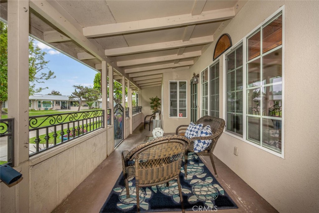 1621 Interlachen Road, Unit 265B Seal Beach, CA 90740 - Photo 8 of 36 a balcony with chairs