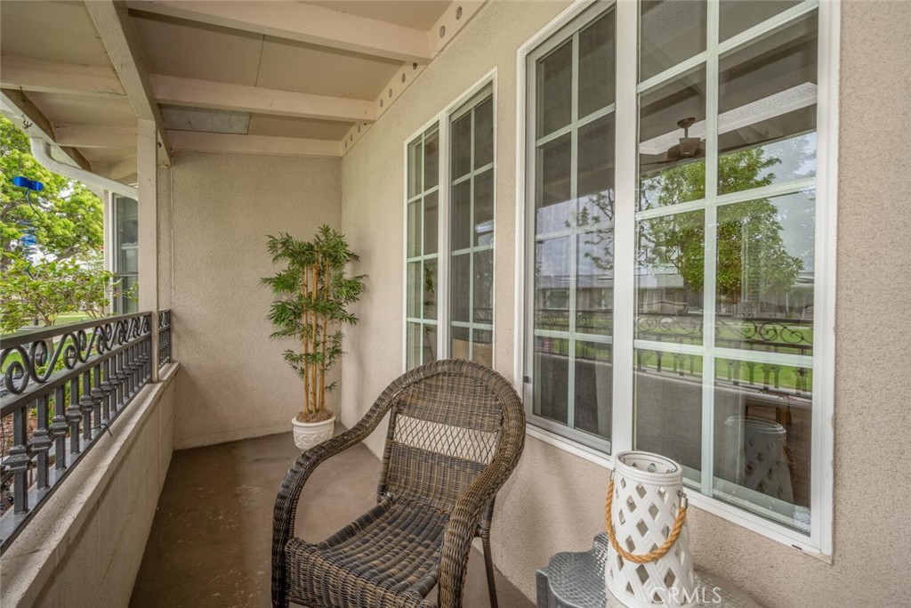1621 Interlachen Road, Unit 265B Seal Beach, CA 90740 - Photo 10 of 36 a balcony with table and chairs