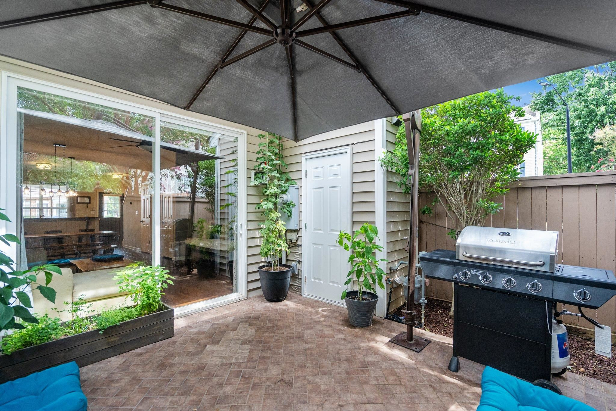 1750 Sorrell Brook Way Raleigh, NC 27609 - Photo 19 of 32 a patio with table and chairs