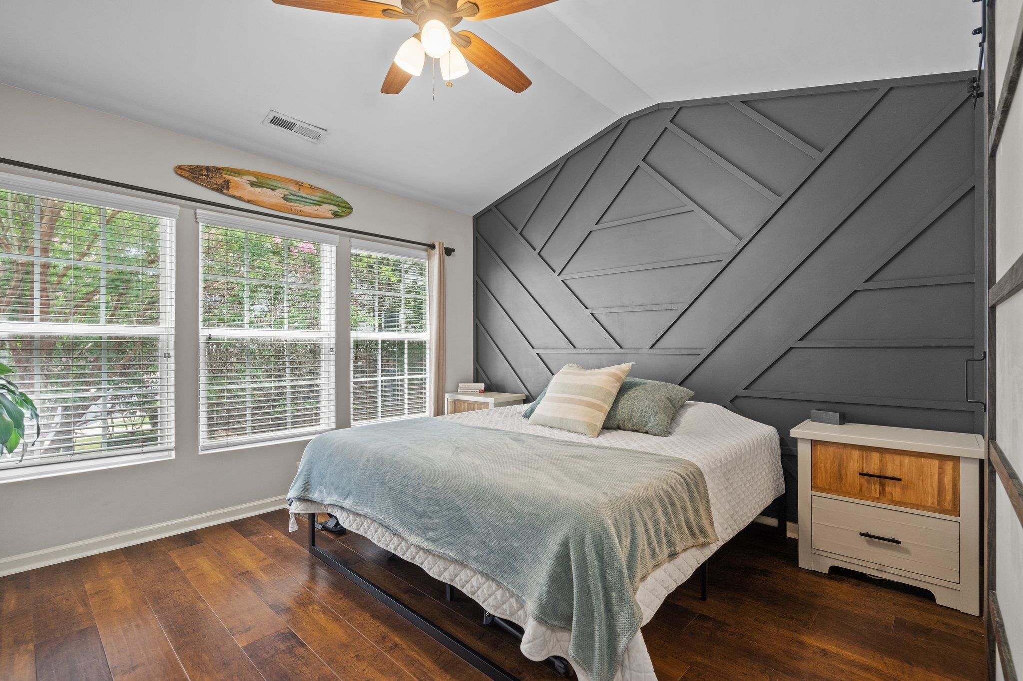 1750 Sorrell Brook Way Raleigh, NC 27609 - Photo 21 of 32 a bedroom with a bed and a large window