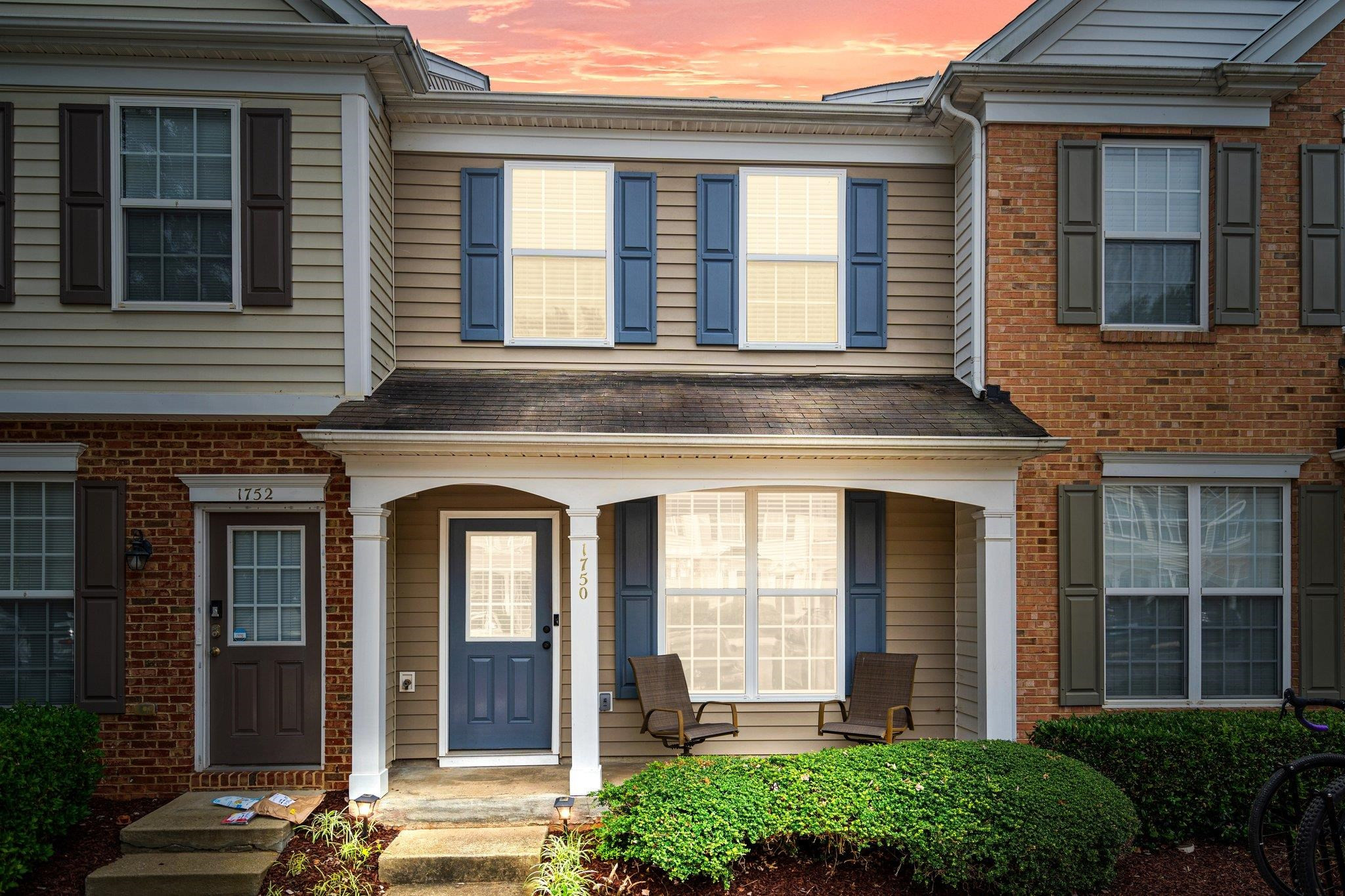 1750 Sorrell Brook Way Raleigh, NC 27609 - Photo 30 of 32 front view of a brick house with a large windows
