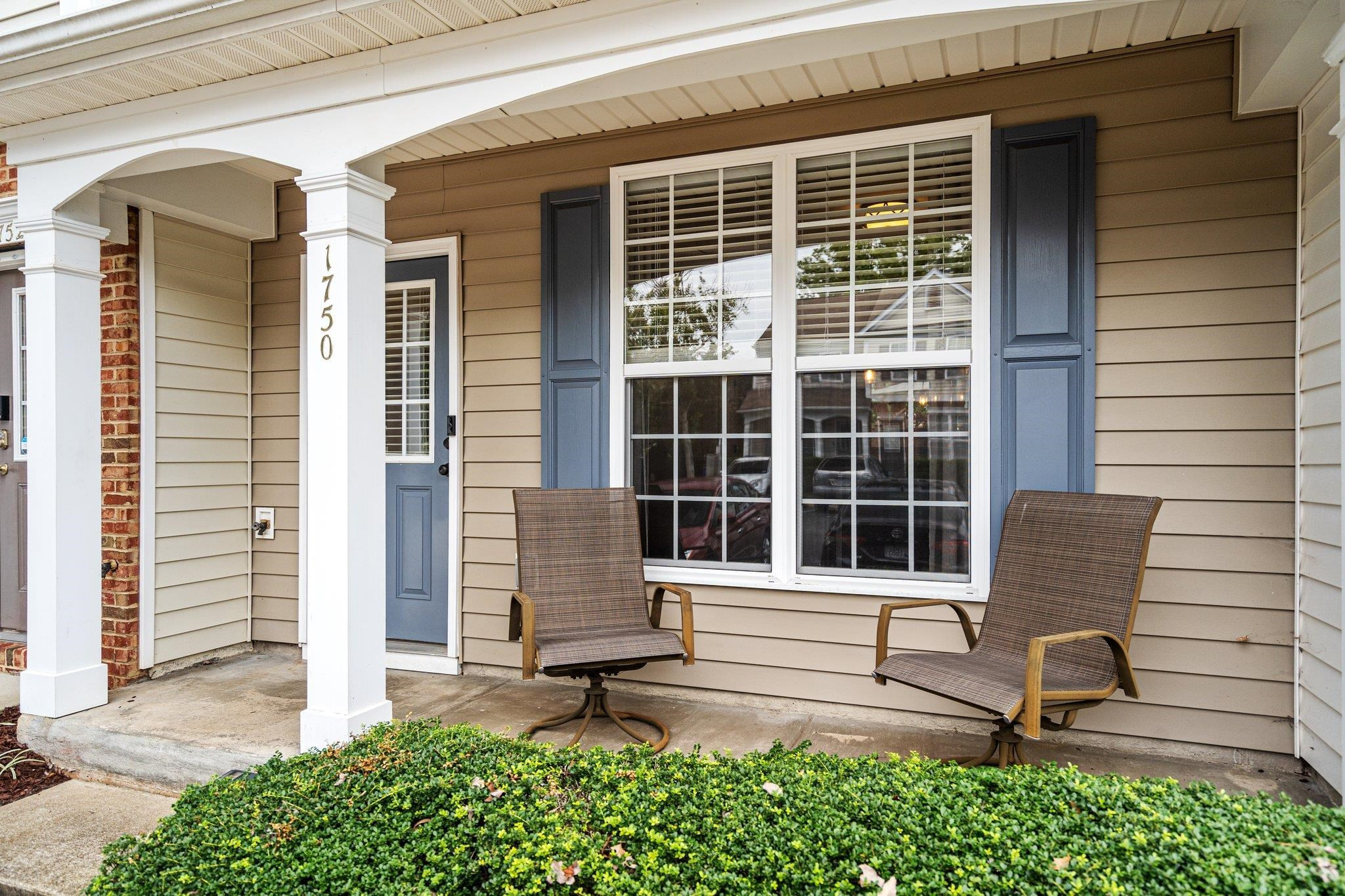 1750 Sorrell Brook Way Raleigh, NC 27609 - Photo 3 of 32 a front view of a house with a yard