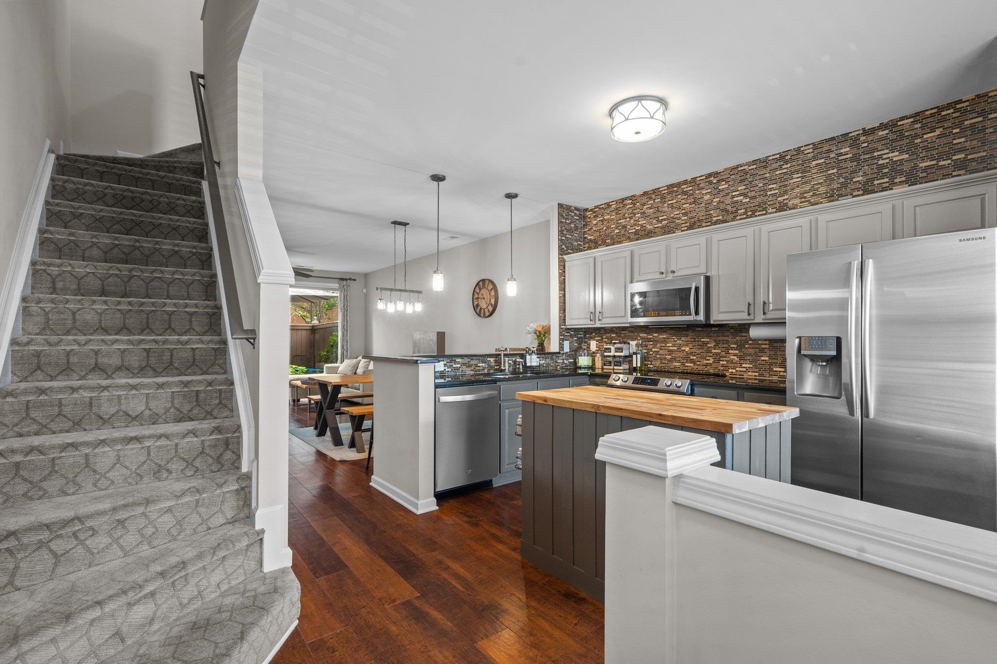 1750 Sorrell Brook Way Raleigh, NC 27609 - Photo 4 of 32 a kitchen with stainless steel appliances a refrigerator and a stove top oven