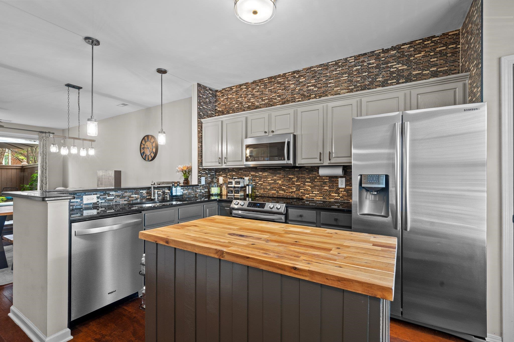 1750 Sorrell Brook Way Raleigh, NC 27609 - Photo 5 of 32 a kitchen with stainless steel appliances granite countertop a refrigerator a stove and a sink