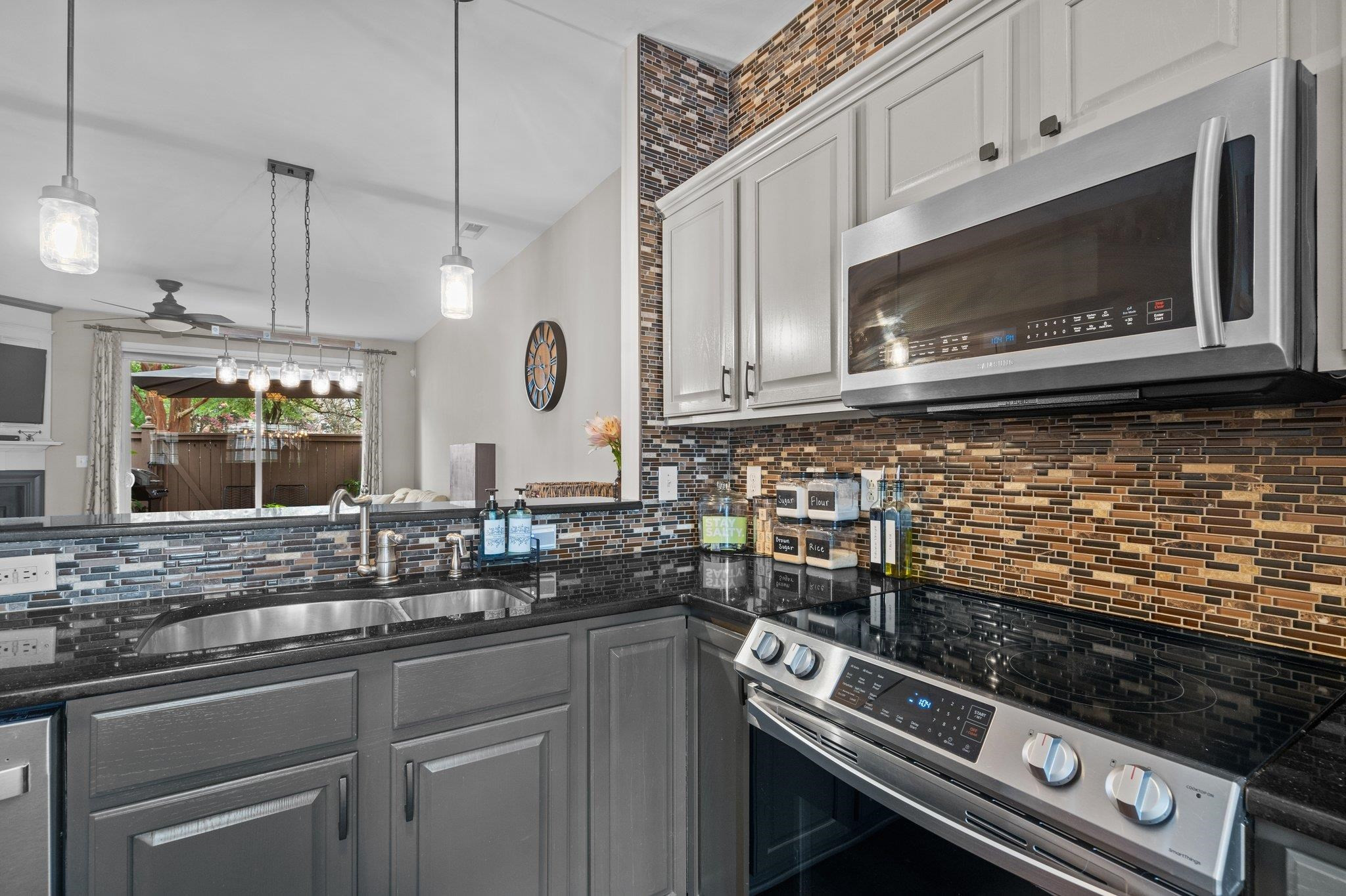 1750 Sorrell Brook Way Raleigh, NC 27609 - Photo 7 of 32 a kitchen with a stove microwave and sink