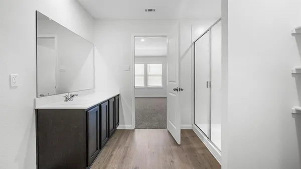 a view of kitchen view wooden floor and living room