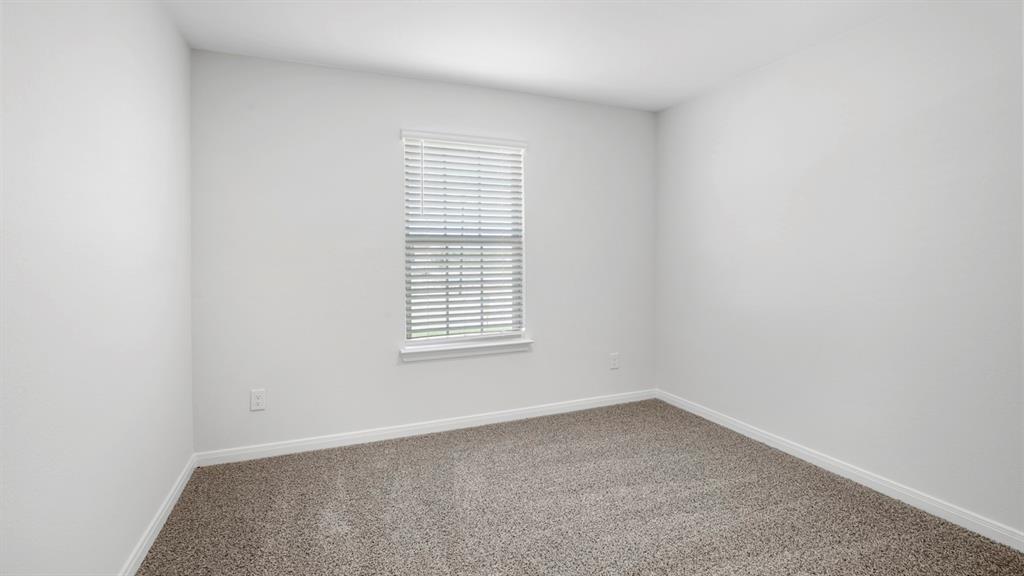 1921 Reveille Way Terrell, TX 75160 - Photo 5 of 25 an empty room with a window