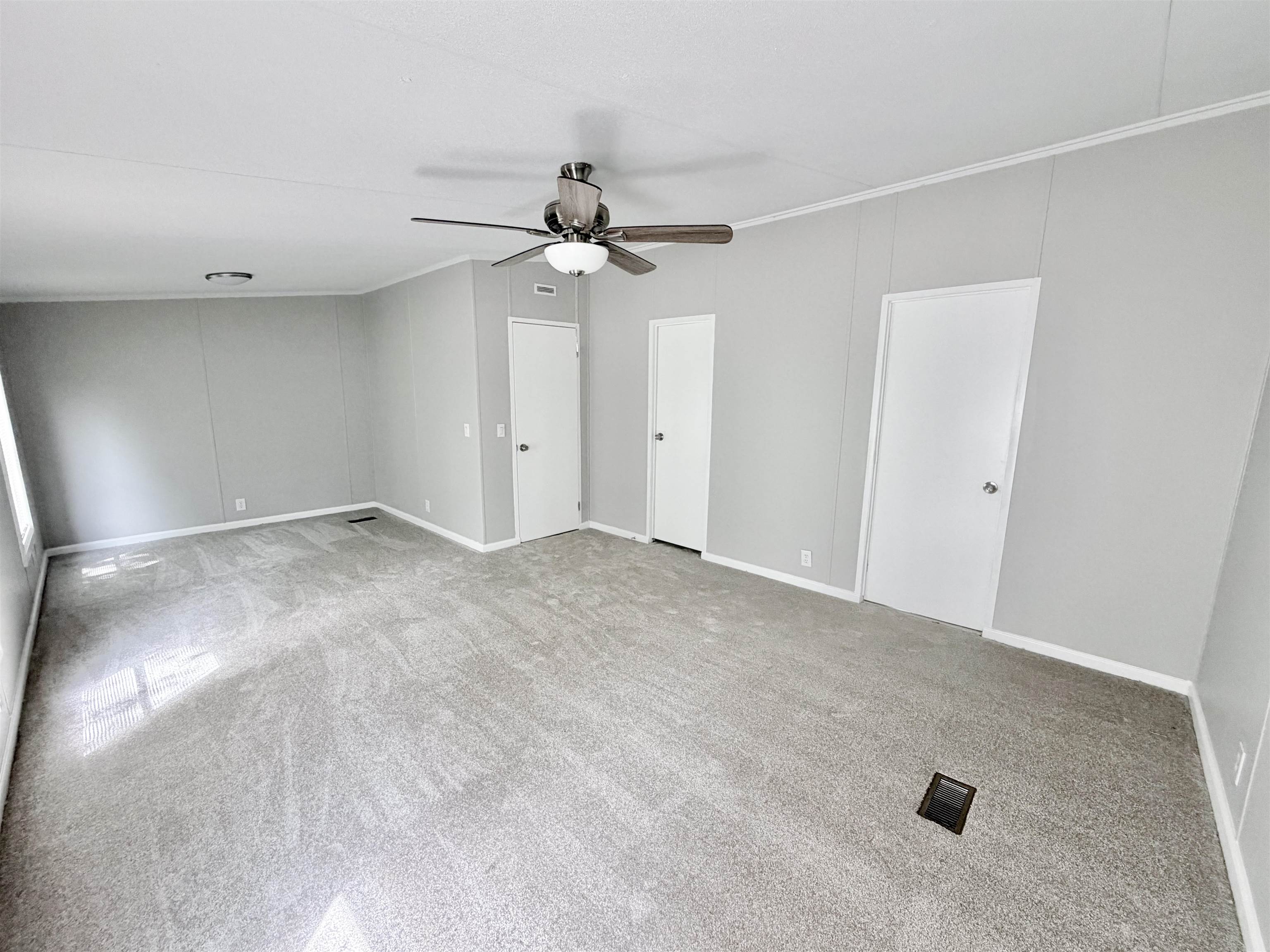 1655 Fayne Road Brighton, TN 38011 - Photo 15 of 28 Spacious room with light gray carpet flooring and matching wall paneling