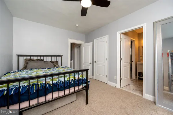 a bedroom with furniture and a window