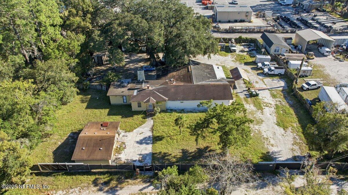 5070 Elinor Road Jacksonville, FL 32257 - Photo 3 of 10 an aerial view of a house with a garden and lake view